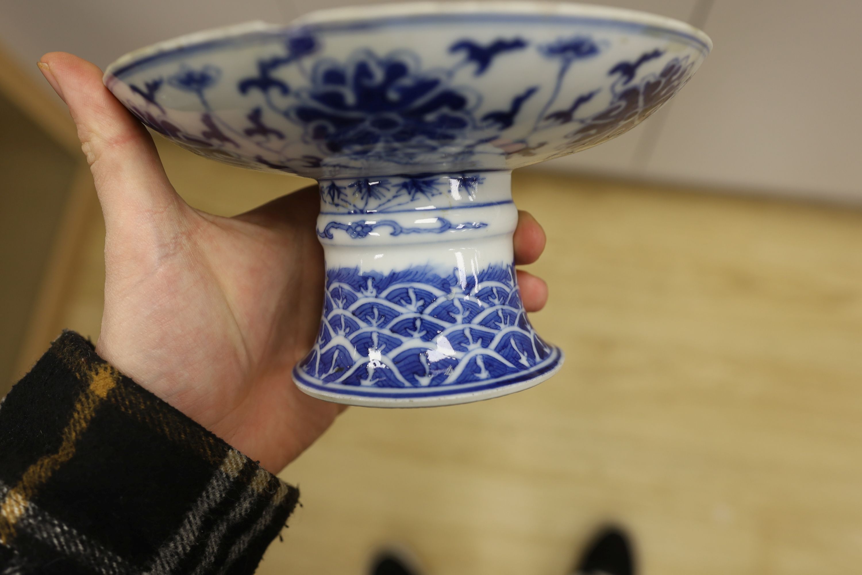 A Chinese underglaze copper red ‘herder and goats’ vase, Kangxi six character mark but Republic period and a Chinese blue and white lotus stem dish, six character Guangxu mark and period, both damaged